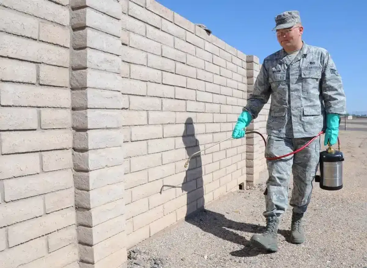 Technician preparing a rodent control treatment