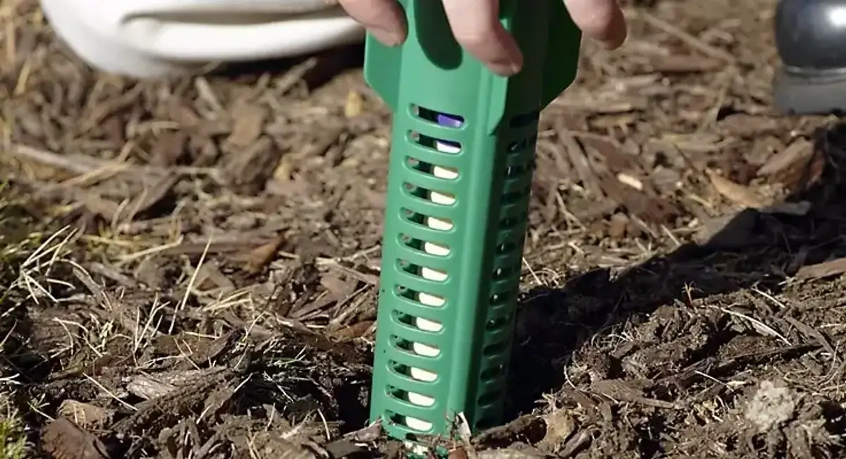 Sentricon termite bait station installed near a home foundation