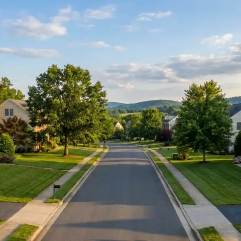 Suburban neighborhood in New Baltimore Virginia with colonial homes, mature trees, and rolling Fauquier County hills