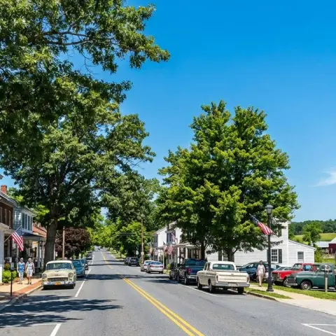 Charming historic Main Street in Poolesville Maryland with mature trees and white clapboard buildings