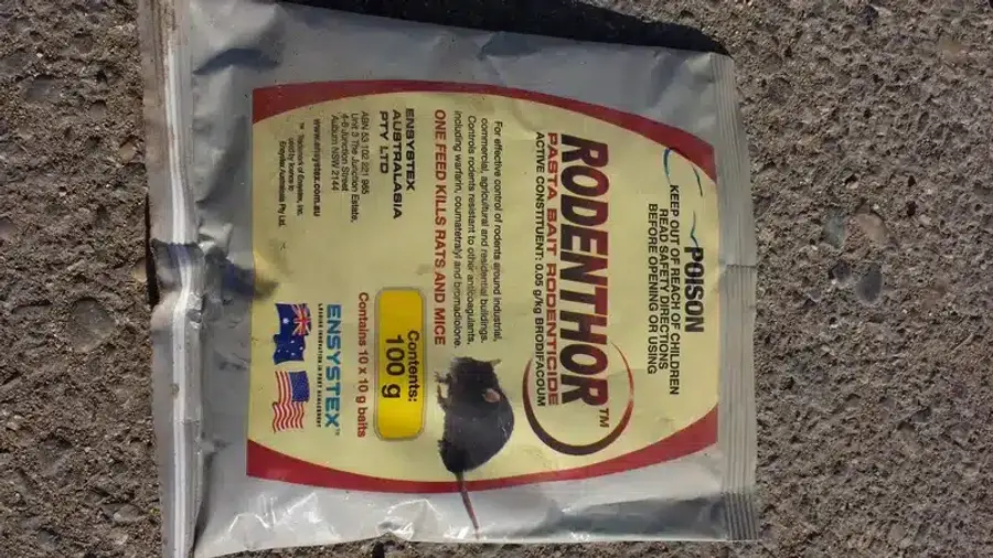 Rodenticide packaging on a surface