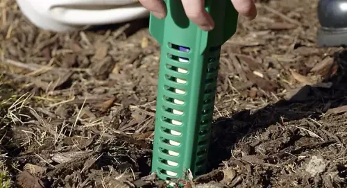 Sentricon termite bait station being installed at a Herndon property near Fox Mill Estates