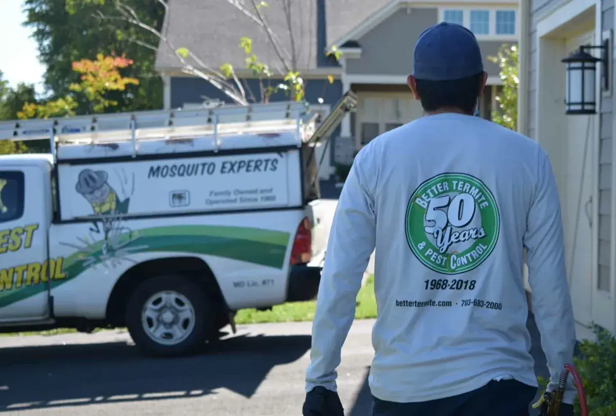 Better Termite technician walking to service truck