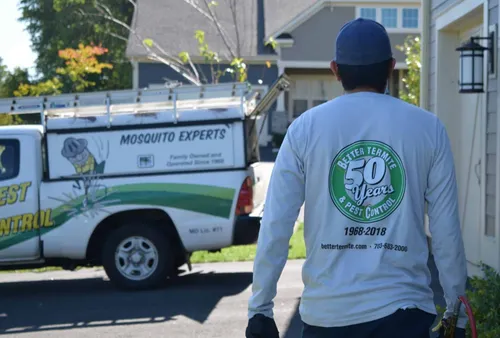 Better Termite technician heading to service truck after completing a Northern Virginia home inspection