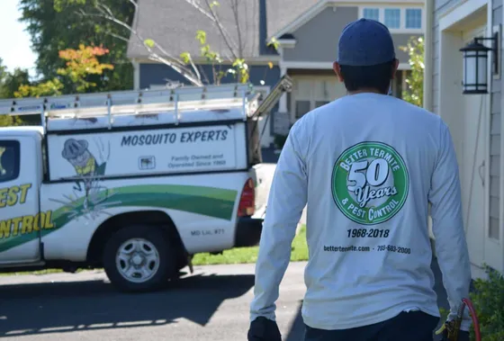 Better Termite technician heading to service vehicle after completing pest inspection at Marshall Virginia property