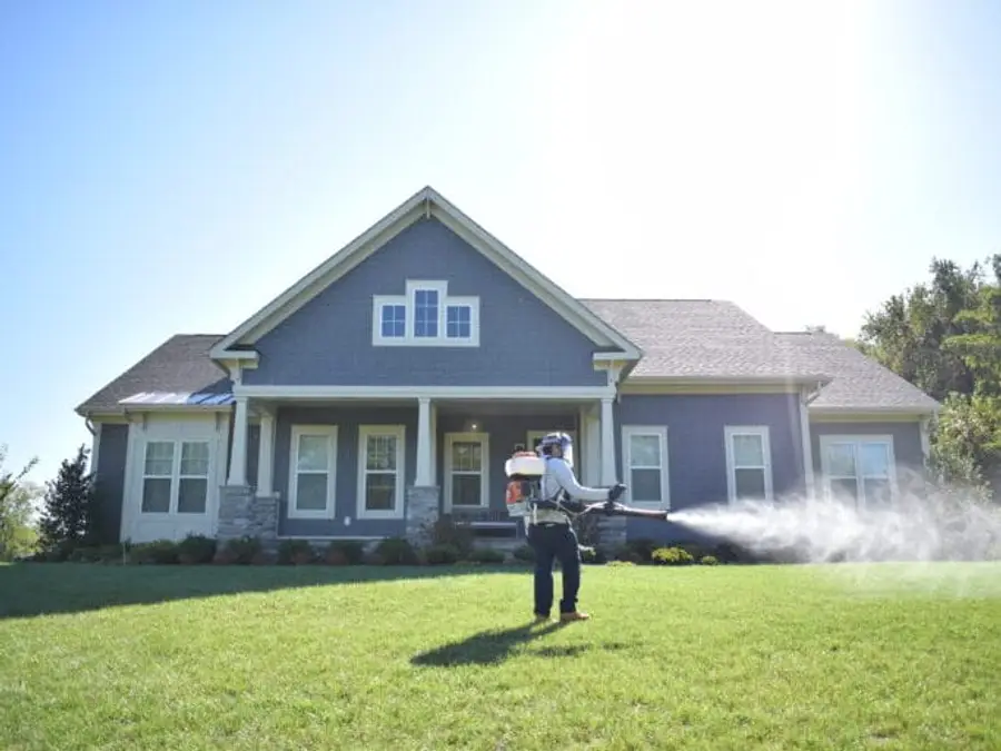 Technician performing mosquito treatment