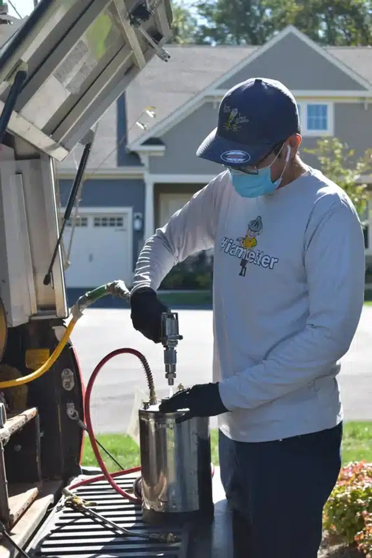 Pest control technician preparing treatment equipment
